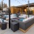 Apartments for Rent in Tracy, CA - The Vela - Relaxing Outdoor Lounge with Fire Pit, Cozy Seating, String Lights, and Pool Views