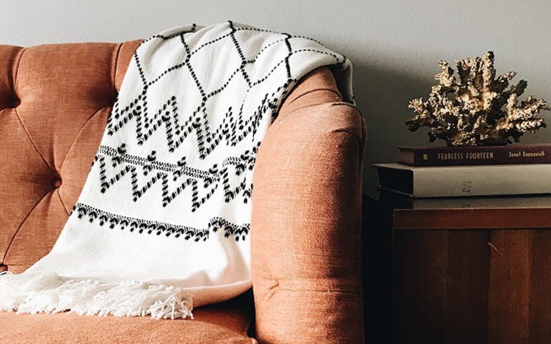 modern decor and a patterned throw on a couch